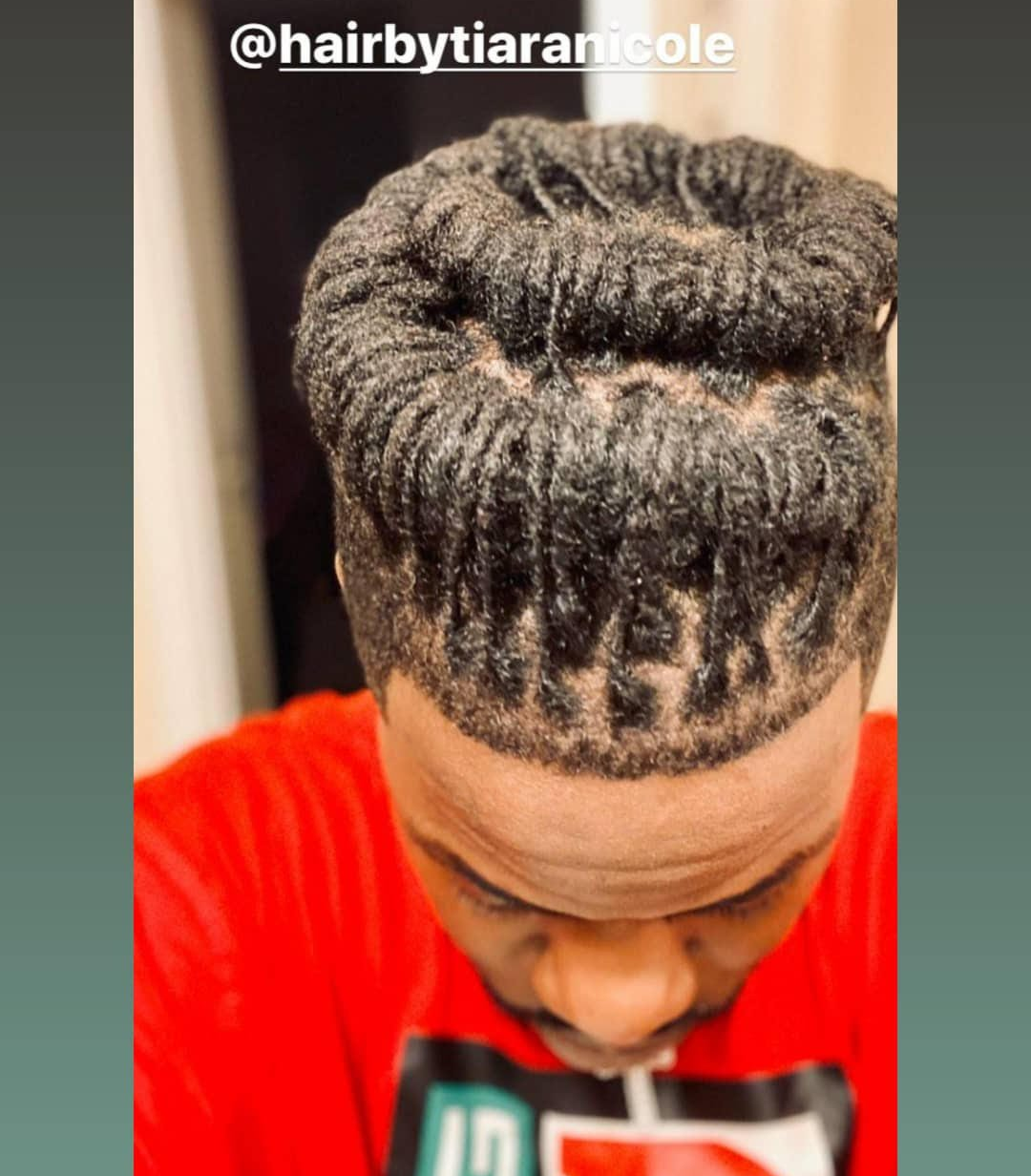 Top view of tightly braided hair styled into a circular pattern, with a @hairbytianicole watermark.